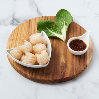 Prepared shrimp dumplings on tray ready to be eaten.